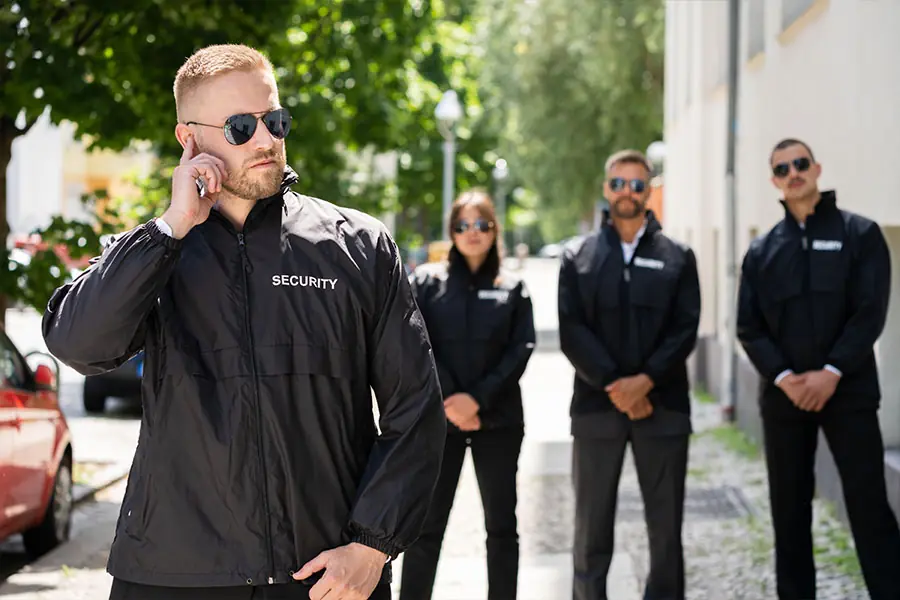 professional security guards patrolling modern residential neighborhood